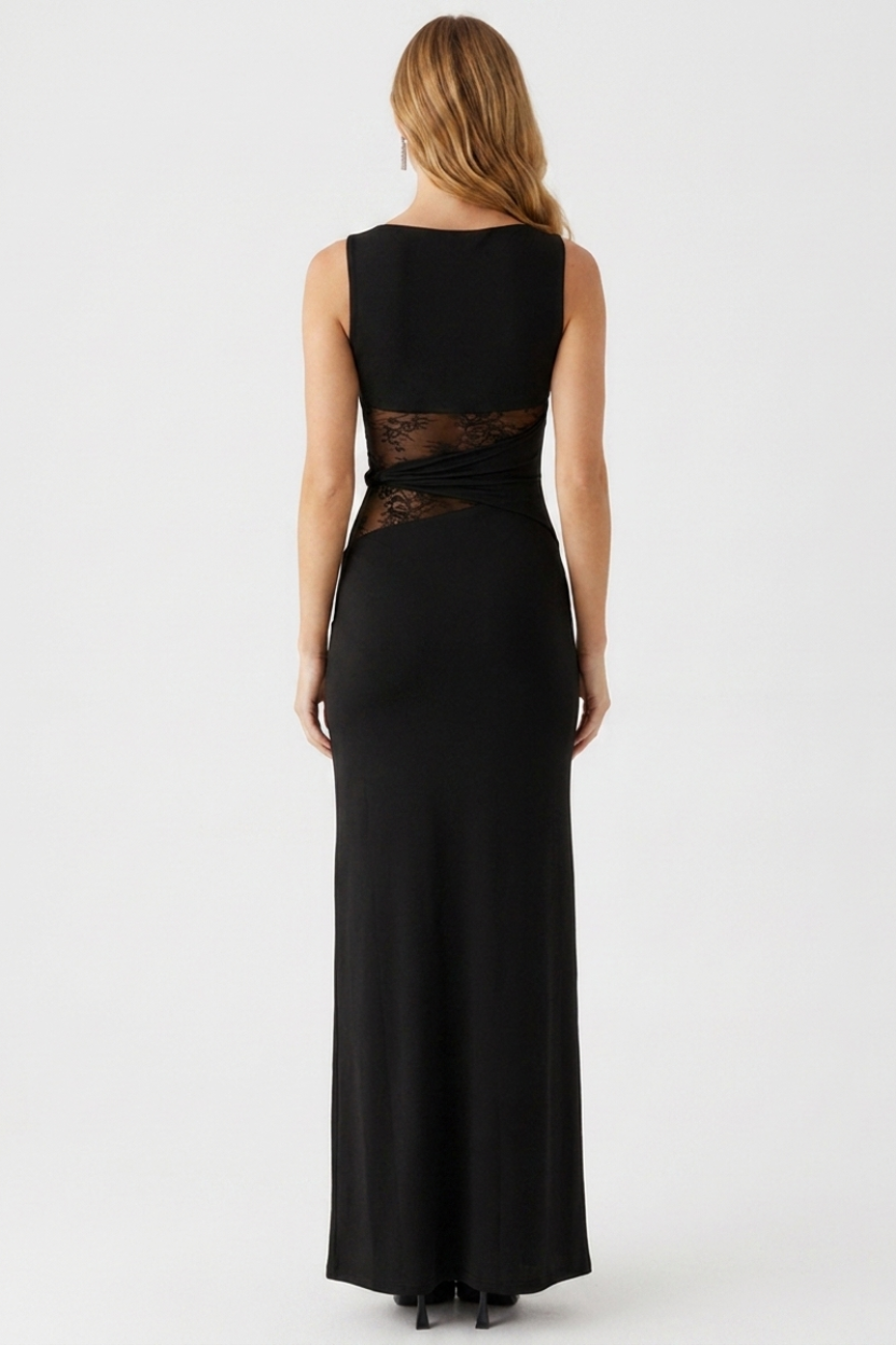Black evening gown with sheer lace detailing on a white background