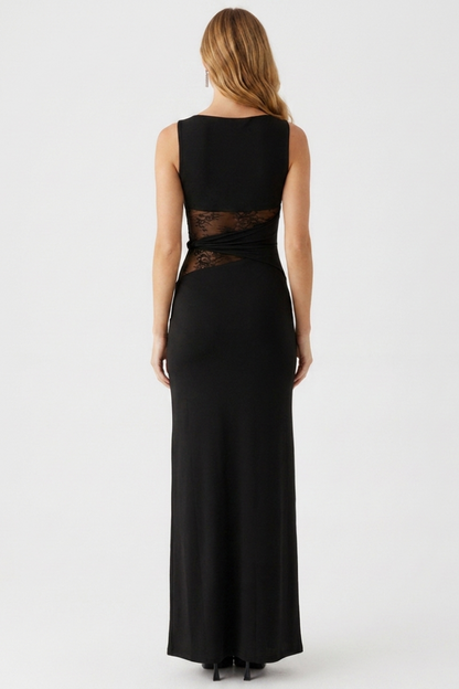 Black evening gown with sheer lace detailing on a white background