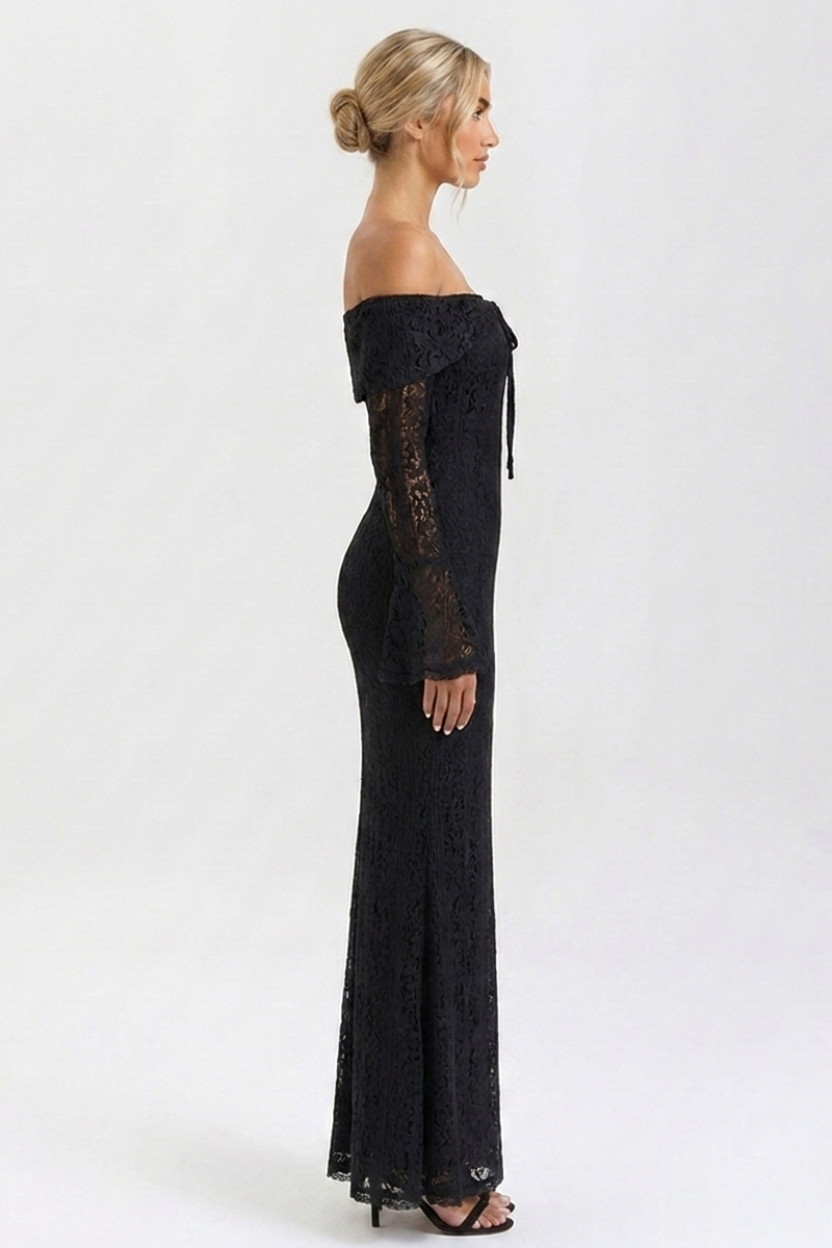 Woman wearing a black off-shoulder lace dress on a white background