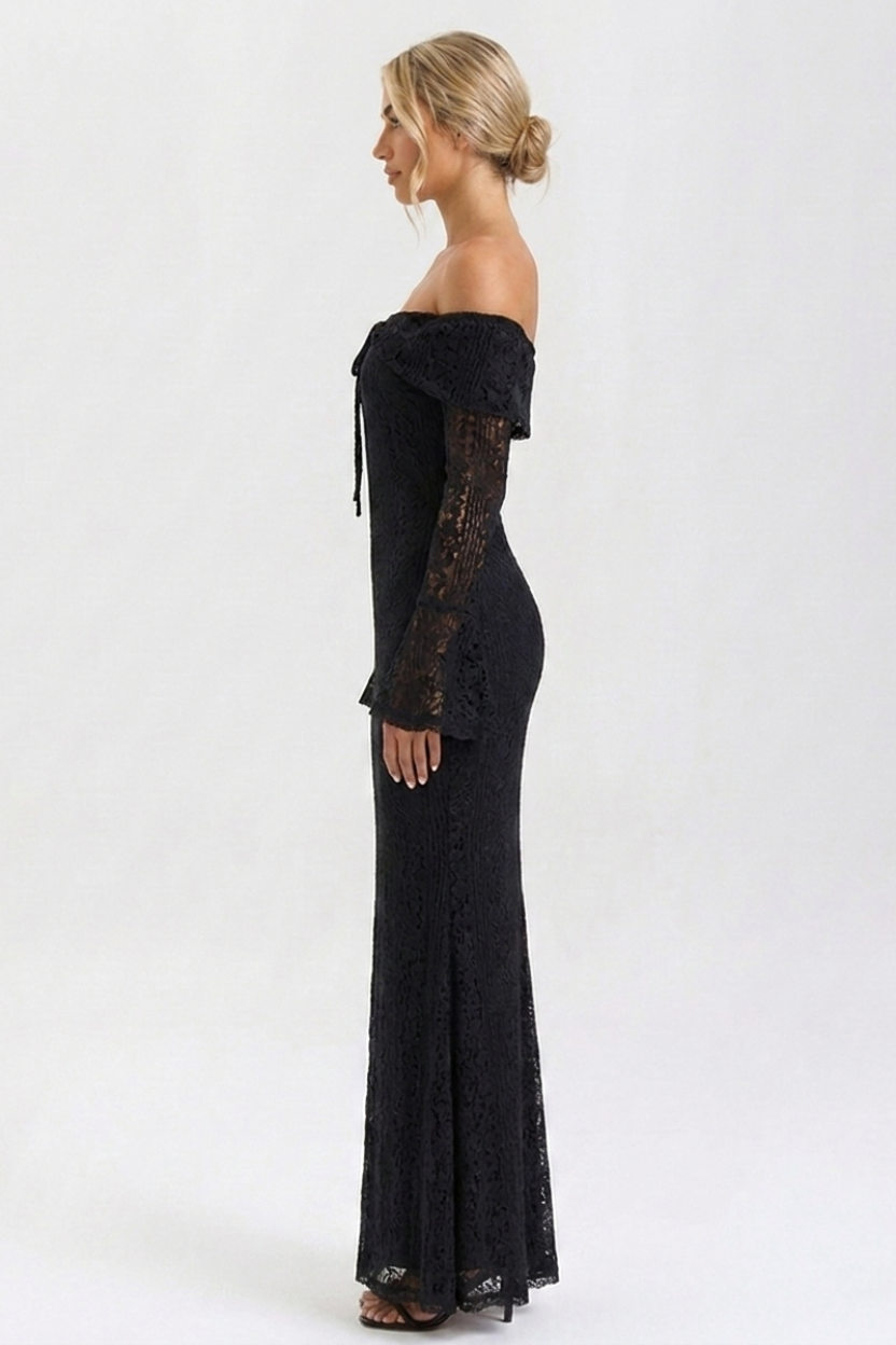Woman wearing a black off-shoulder dress with lace sleeves on a white background